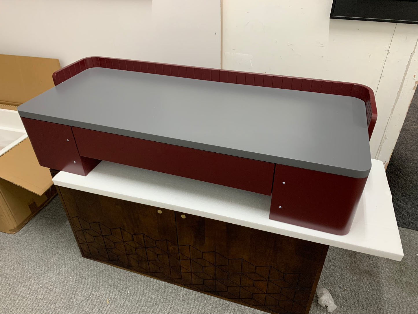 "Mid-century modern luxury wide desk in mid grey and burgundy with retro brass accents