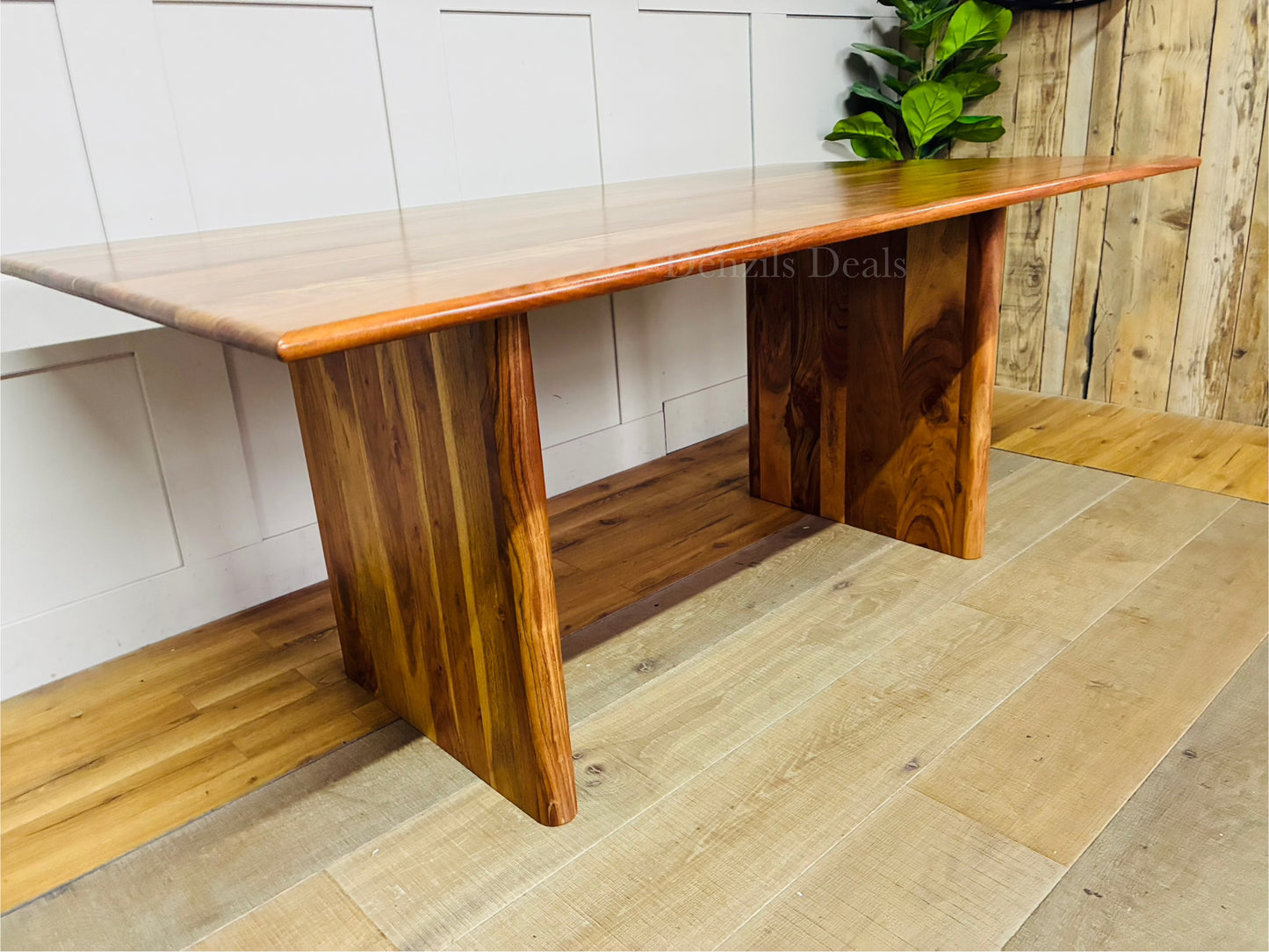 180cm rectangular dining table made of solid acacia wood featuring a warm natural grain, rounded top edges, and soft curved legs