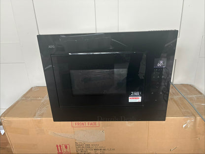 Front view of the AEG OB6SM261UB 6000 Series built-in microwave oven, featuring a sleek, minimalist all-gloss black glass finish. The front panel includes a horizontal LED digital display and touch-sensor controls on the right side, with an invisible push-to-open door mechanism