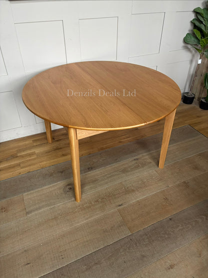 Fishe and Lilly Wright round extendable dining table made from solid light oak wood