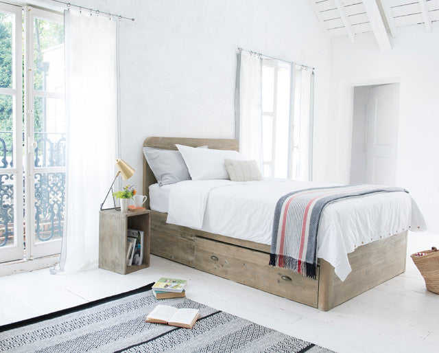 A Loaf Woody double bed frame handcrafted from textured, reclaimed solid fir wood. The rustic, natural wood frame features a raw-looking headboard with exposed grain variations, minimalist clean lines, and integrated under-bed storage space