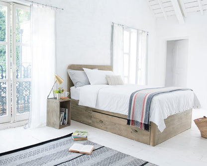 A Loaf Woody double bed frame handcrafted from textured, reclaimed solid fir wood. The rustic, natural wood frame features a raw-looking headboard with exposed grain variations, minimalist clean lines, and integrated under-bed storage space