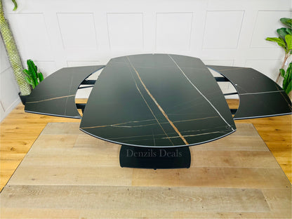 A black ceramic marble-effect dining table extending from 150cm to 220cm, showing the rotating mechanism that reveals side extension leaves to comfortably seat up to 8 people, showing the extension mechanism 