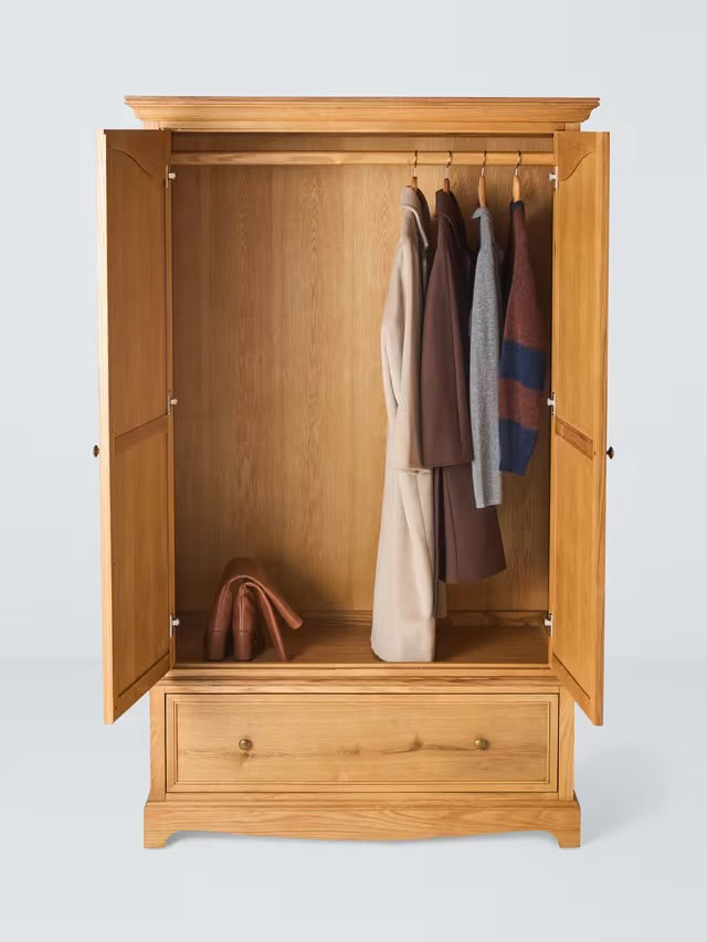 A classic John Lewis double-door wardrobe made from weathered oak, featuring an upper hanging compartment and a wide storage drawer at the base