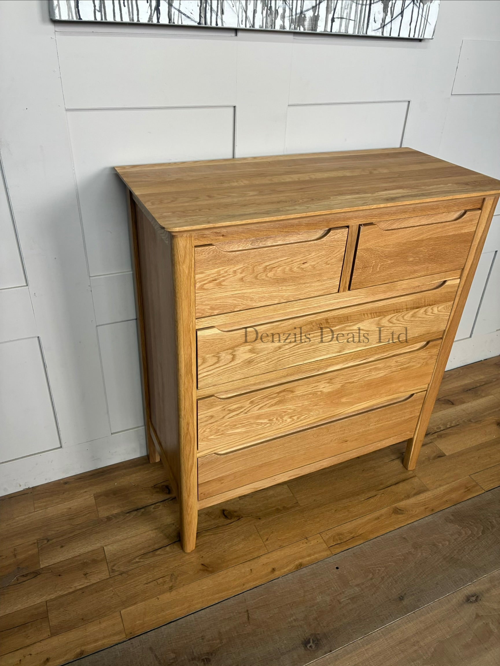 A contemporary Copenhagen range 5-drawer chest of drawers by Oak Furnitureland, crafted from natural solid oak with a light blonde finish. Features a 2-over-3 drawer layout, clean Scandi-style lines, rounded corners, and sleek recessed handles