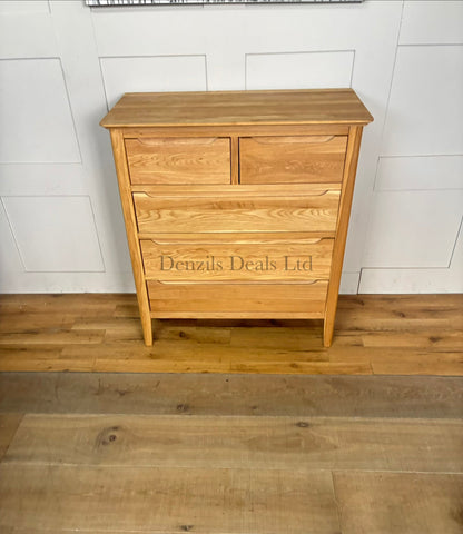 A contemporary Copenhagen range 5-drawer chest of drawers by Oak Furnitureland, crafted from natural solid oak with a light blonde finish. Features a 2-over-3 drawer layout, clean Scandi-style lines, rounded corners, and sleek recessed handles