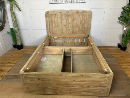 A cozy bedroom setting featuring the Loaf Woody solid wood double bed. The rustic, raw-textured eco-conscious fir frame is dressed in crisp white linens and neutral bedding, positioned against a soft-toned wall to highlight its natural, warm wood grain