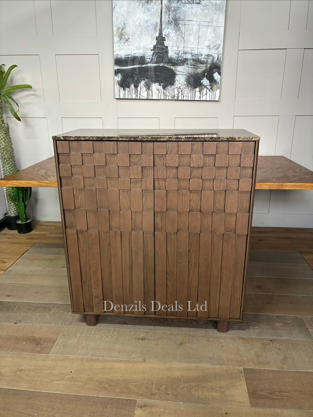 A dark-stained oak drinks cabinet featuring a patterned check and stripe exterior design, top glass storage, and a polished Emperador marble top