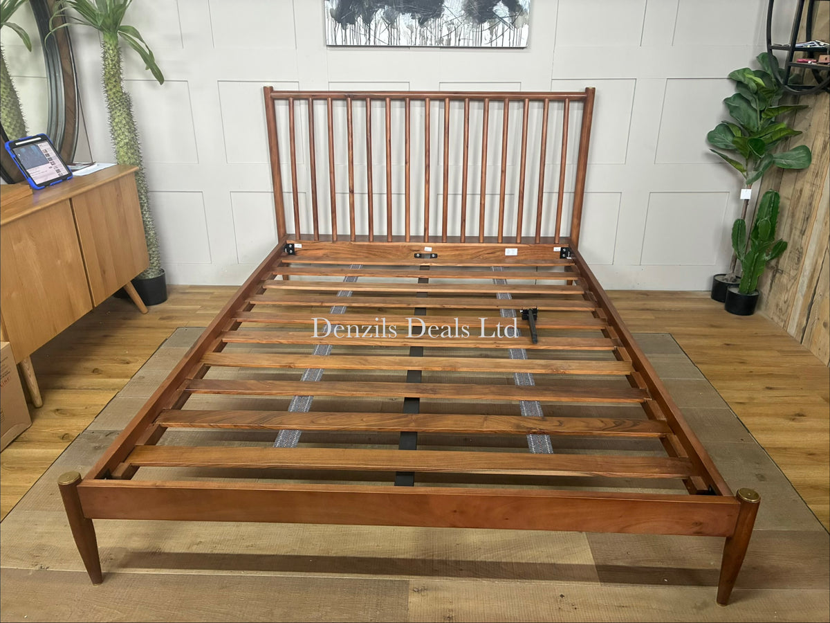A king-size wooden bed frame made from dark brown acacia wood by swoon featuring a modern vertical-slatted spoked headboard.
