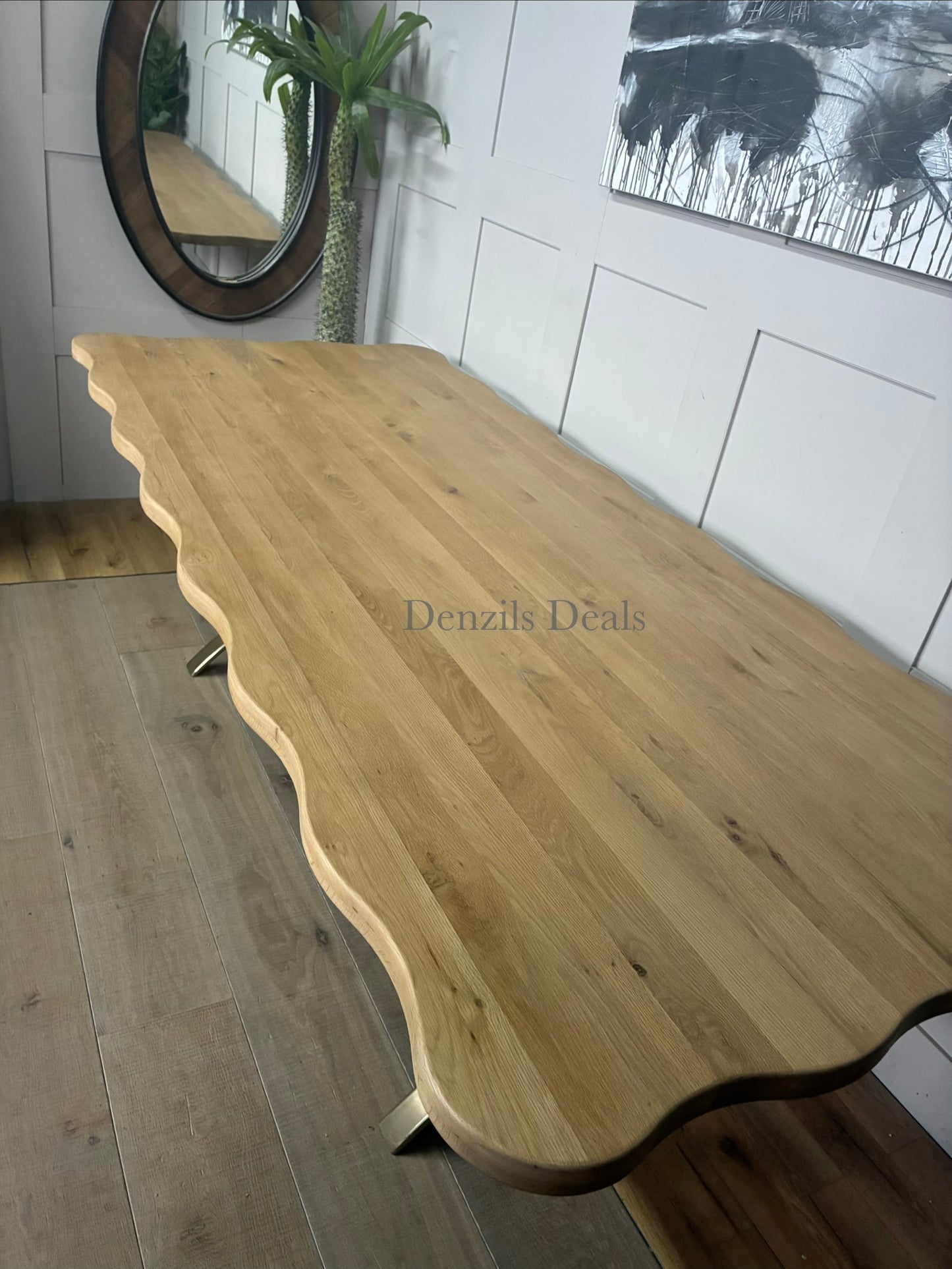 A long rectangular dining table made of solid oak and tropical hardwood with a natural oak finish, showcasing a distinct light wood grain texture.