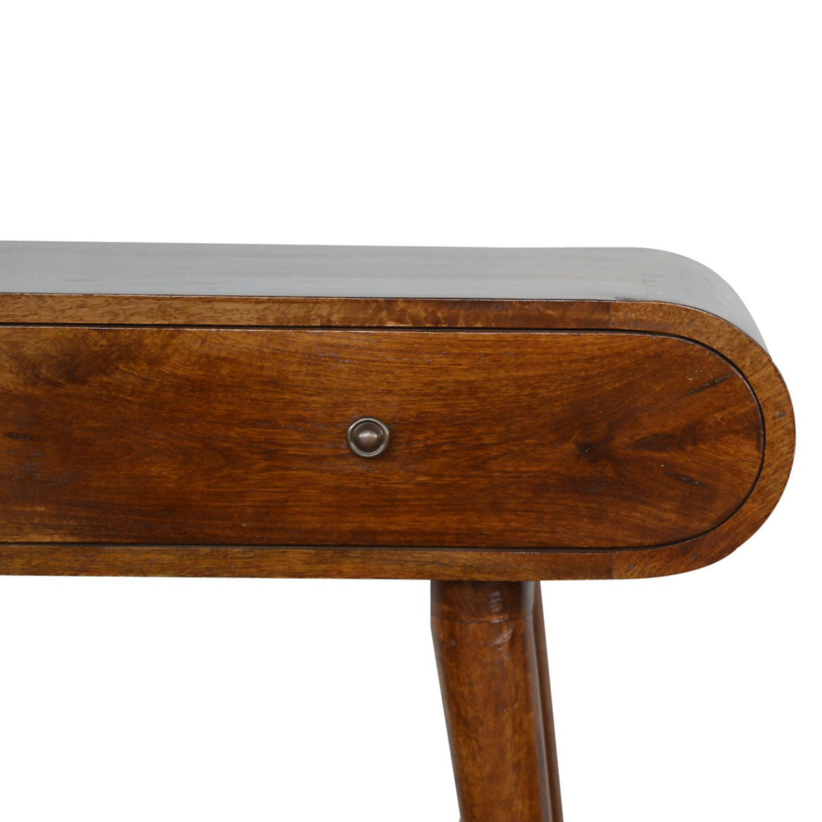 : A mid-century modern style console table made of solid mango wood with a rich chestnut finish, featuring a unique curved pill-shape top, two seamless drawers with small metallic knobs, and four tapered wooden legs.