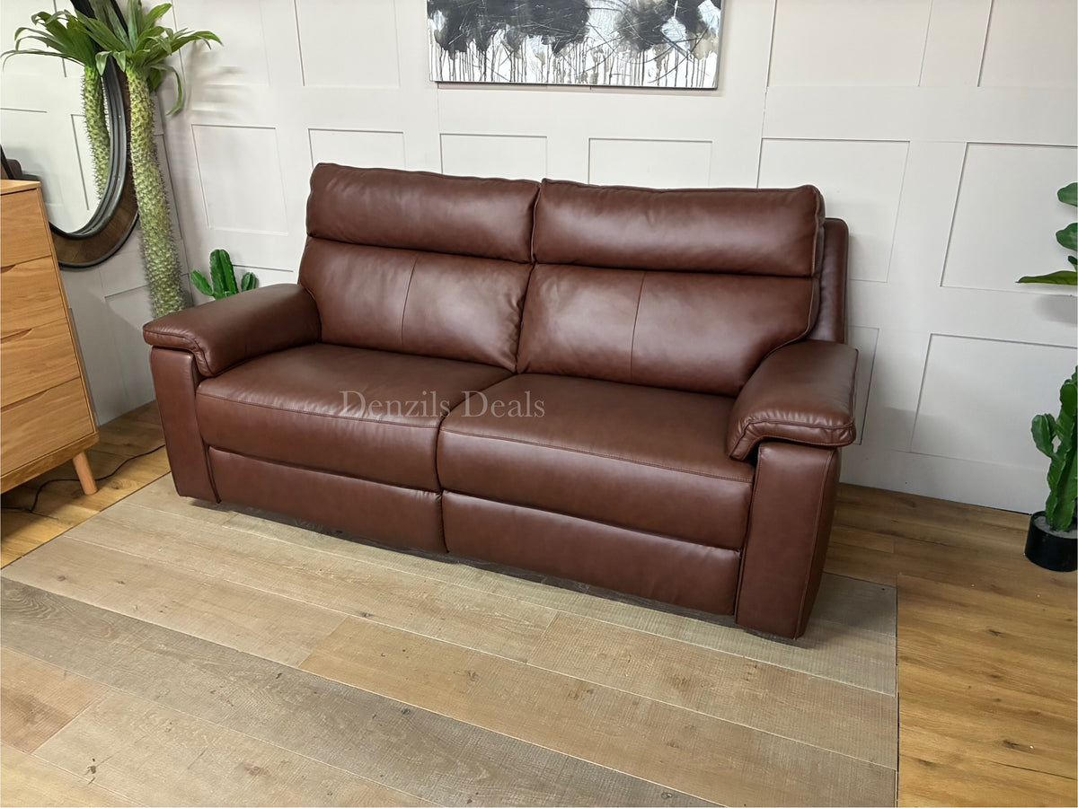 A modern 3-seater electric recliner sofa upholstered in smooth, rich chestnut brown leather from the Selby range, featuring sleek lines, wide armrests, and contrasting stitch details along the back and seat cushions
