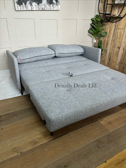A modern Innovation Living Cubed 160 Sofa Bed upholstered in textured Twist Granite grey fabric, featuring a minimalist armless design supported by slim black metal legs.