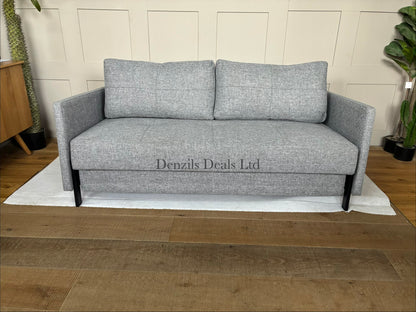A modern Innovation Living Cubed 160 Sofa Bed upholstered in textured Twist Granite grey fabric, featuring a minimalist armless design supported by slim black metal legs.