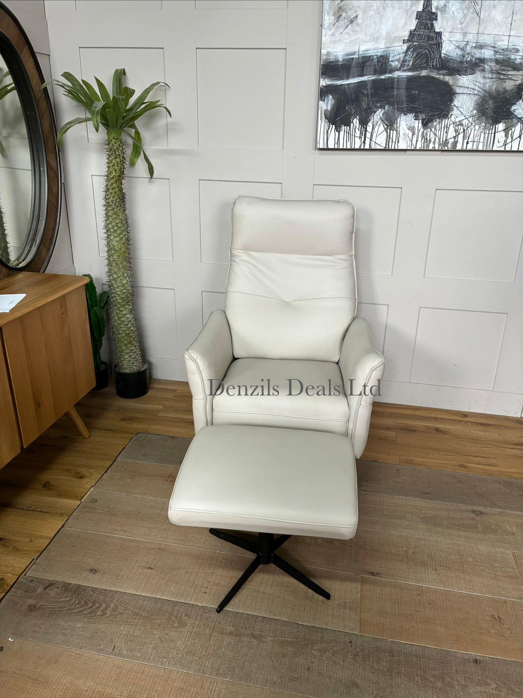 A modern John Lewis Relaxed manual recliner armchair and matching footstool upholstered in natural leather with sleek black metal legs
