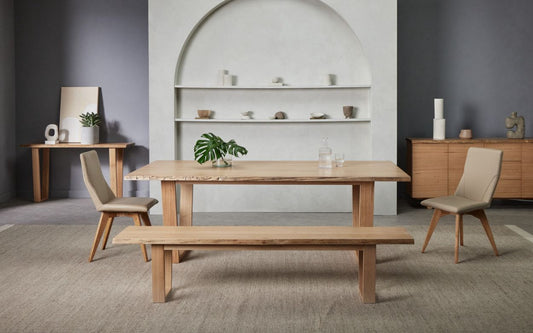 A modern Nick Scali Blox Dining Table featuring a smooth Australian oak wood top and striking geometric angular legs