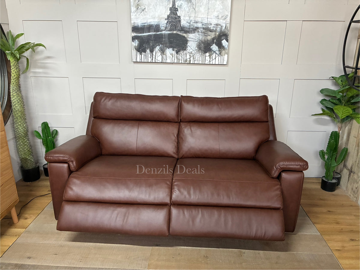 A modern living room featuring the Selby 3-seater power recliner sofa in Chestnut brown leather, styled alongside traditional oak furniture and warm lighting