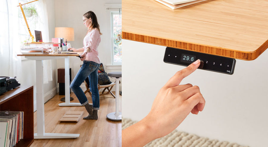 A motorized 120cm wide Fully Jarvis sit/stand desk by Herman Miller, shown with a rectangular natural finish worktop and a sturdy matte black dual-leg steel frame with height adjustment controls.