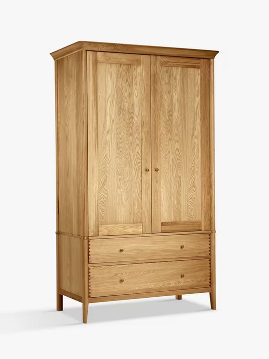A natural solid European oak and oak veneer double wardrobe featuring smooth rounded edges, two cupboard doors, and two storage drawers at the base