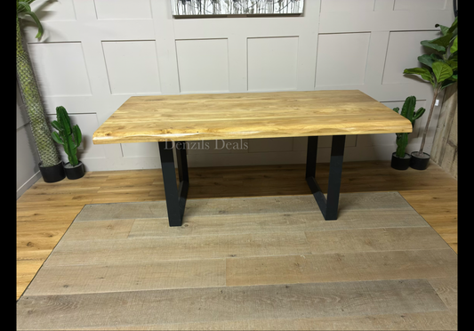 A rectangular Oak Furnitureland Brooklyn 8-seater dining table with a light natural solid oak top, organic wavy "live edges," and industrial dark metal legs.