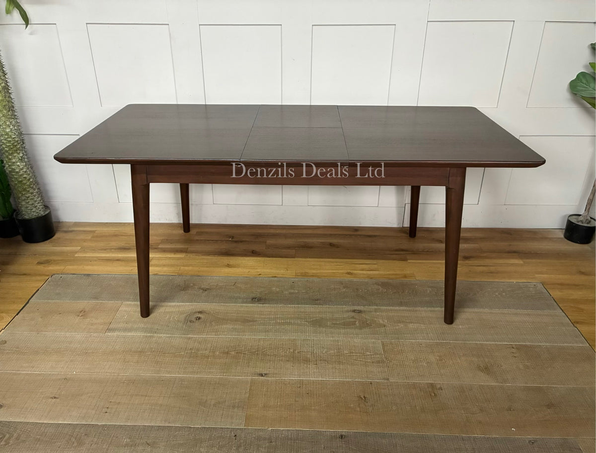 A rectangular mid-century modern dark walnut dining table from the Fishe & Lilly Norway collection, showcasing a rich wood grain and minimalist legs, styled to comfortably seat 4 to 6 people.