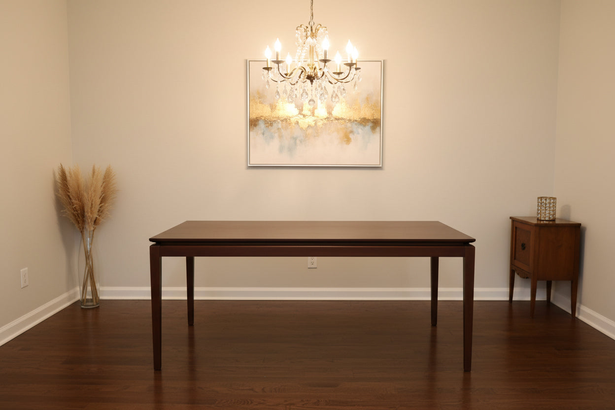A rectangular walnut wood extending dining table by AM.PM, shown in a contemporary style.