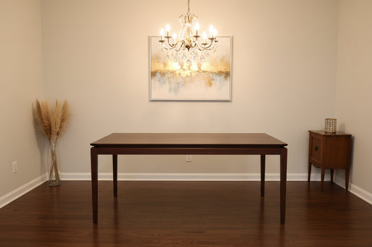 A rectangular walnut wood extending dining table by AM.PM, shown in a contemporary style.
