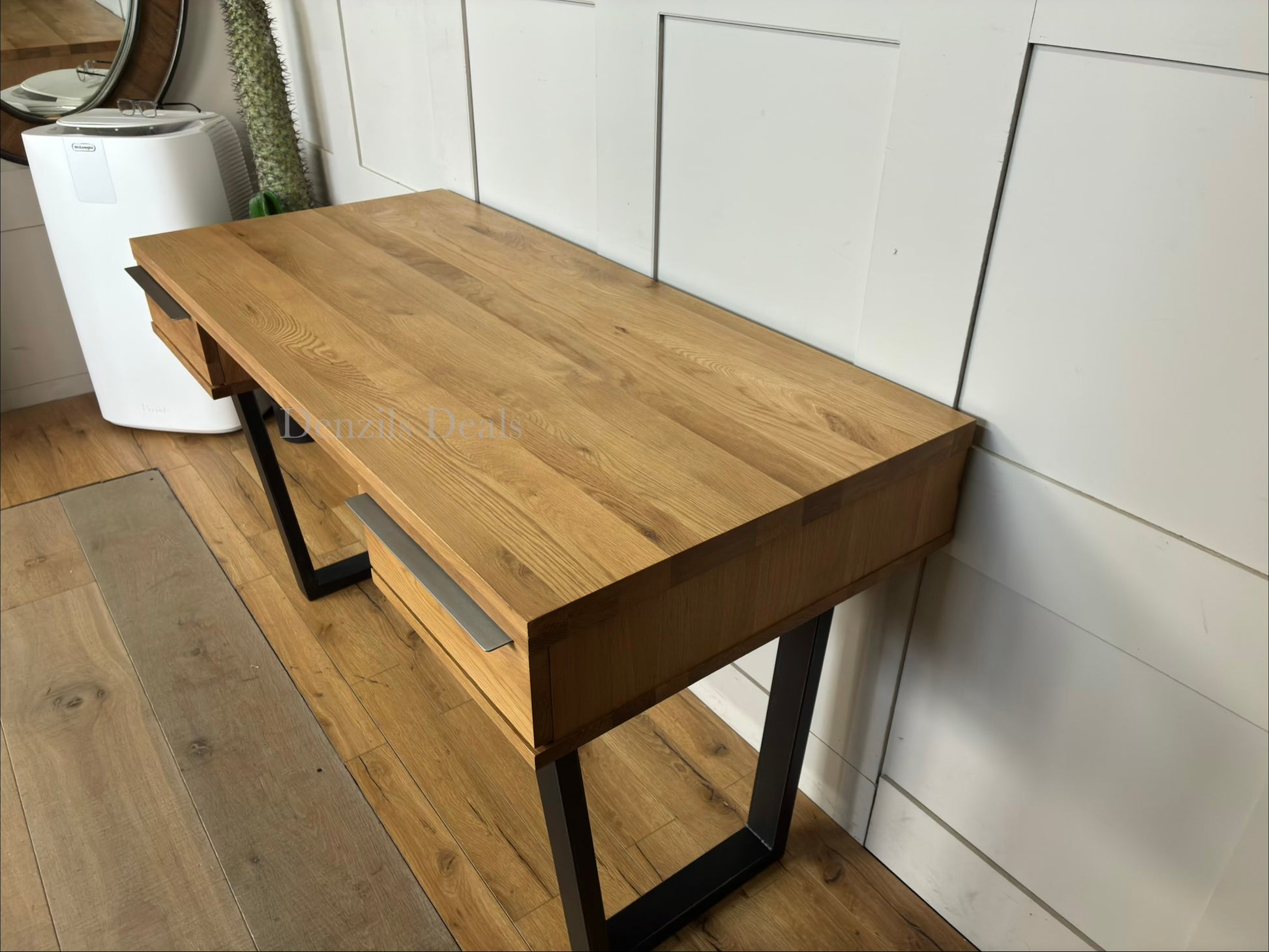 A rustic, light oak writing desk with natural wood grain and an industrial-edged welded iron base.