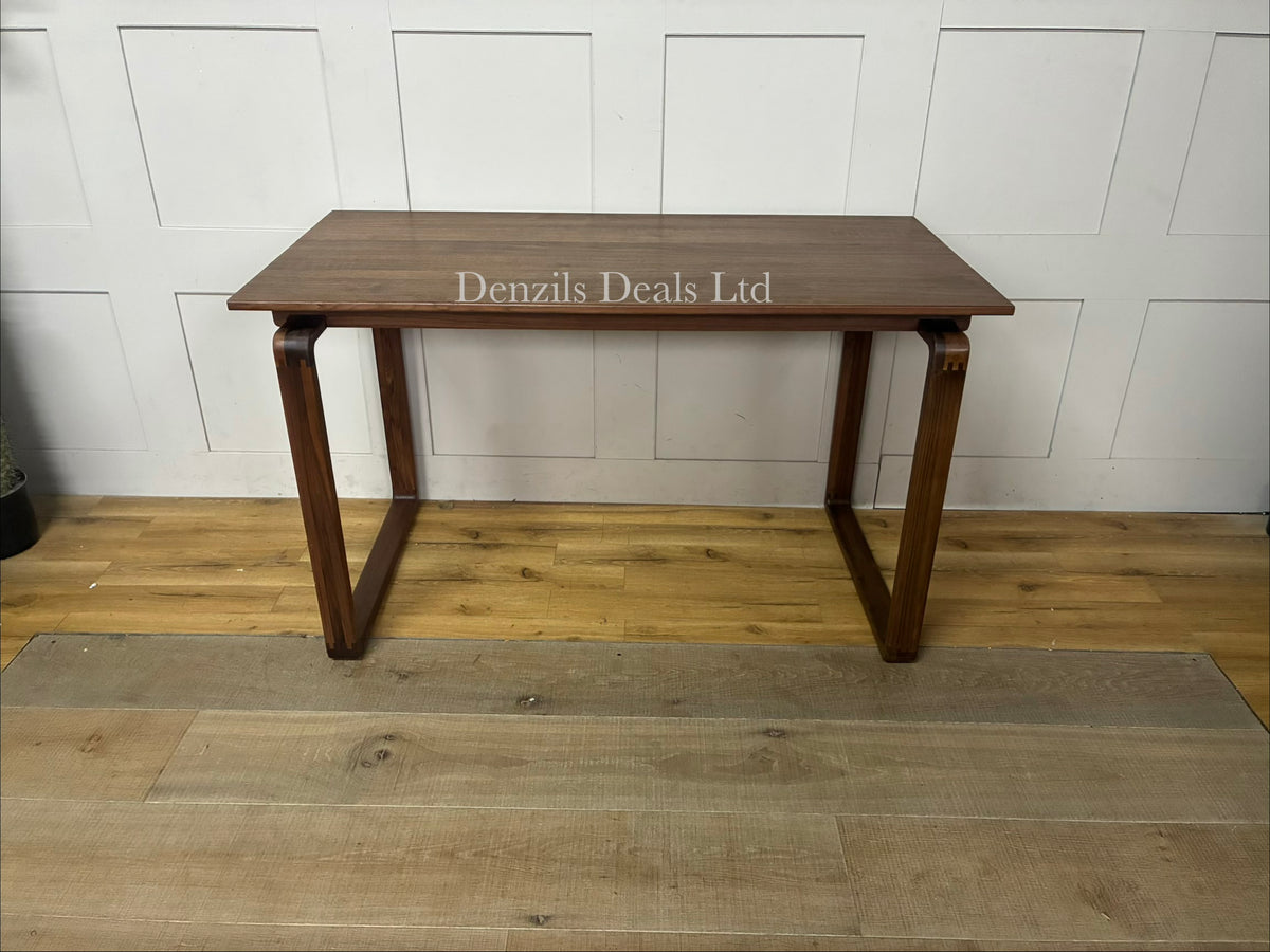 A smooth, spacious rectangular desktop with soft, rounded corners and exposed finger-joint details at the corners, highlighting its traditional cabinet-maker craftsmanship