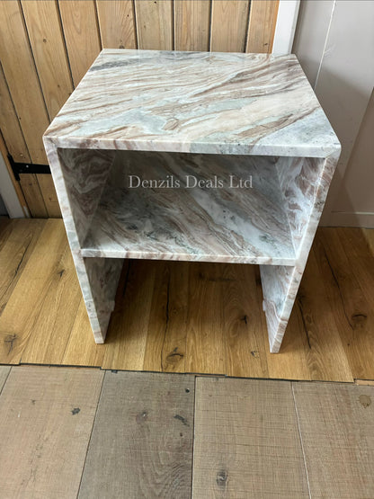 A square Anthropologie Gia side table made entirely of polished white and grey veined marble, featuring a hollow, open-sided cubic design