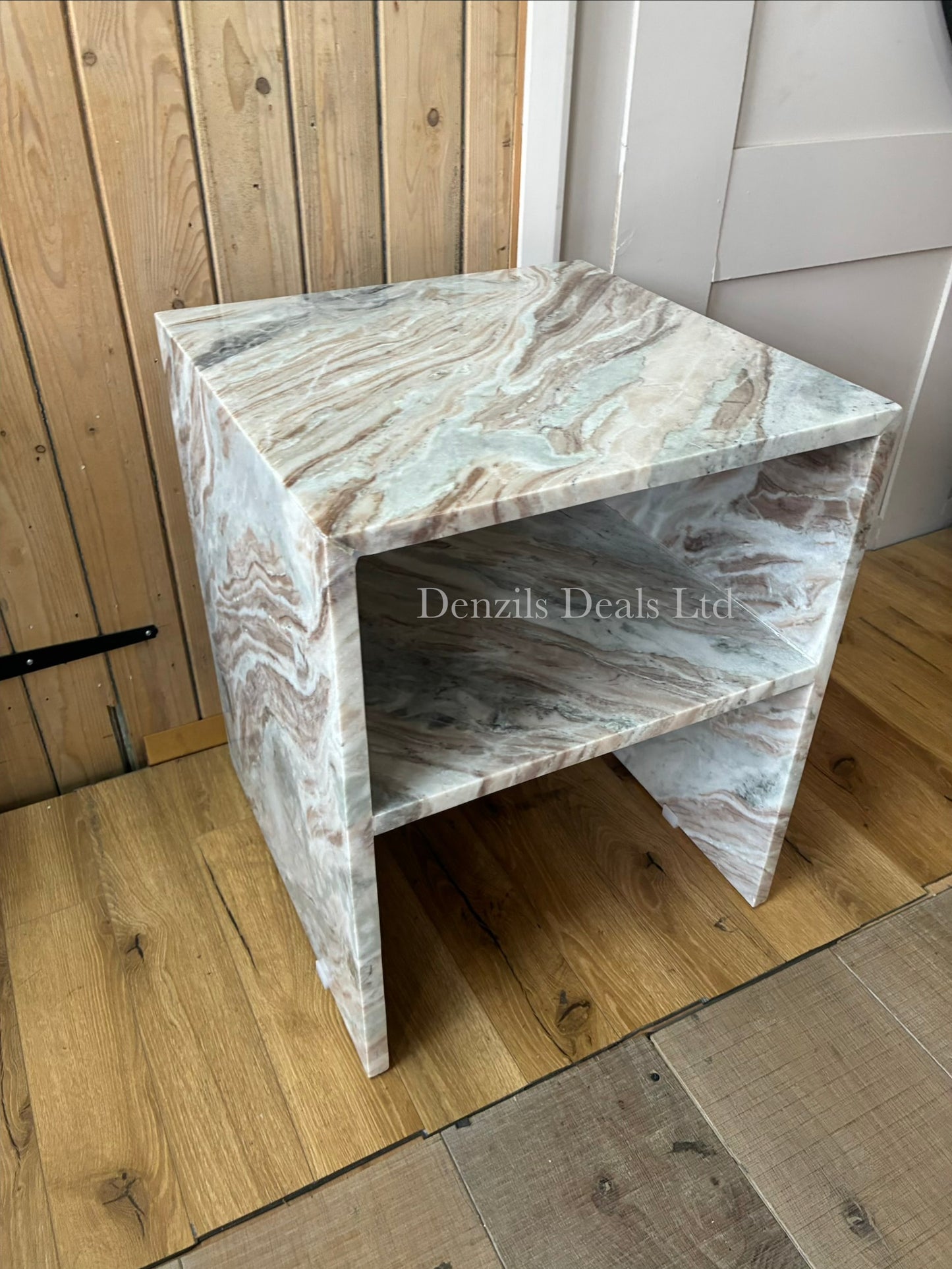 A square Anthropologie Gia side table made entirely of polished white and grey veined marble, featuring a hollow, open-sided cubic design