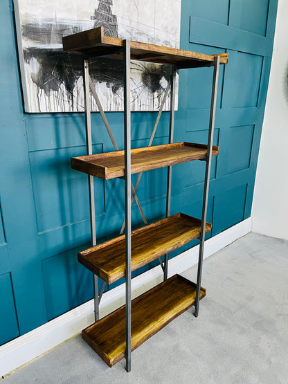 A tall modern bookcase made from light oak veneer, showcasing 5 staggered open shelves. The minimalist geometric framework forms asymmetrical cubbies, highlighting the organic curves of a natural wood live edge. Fully assembled design suited for an alcove or accent wall."