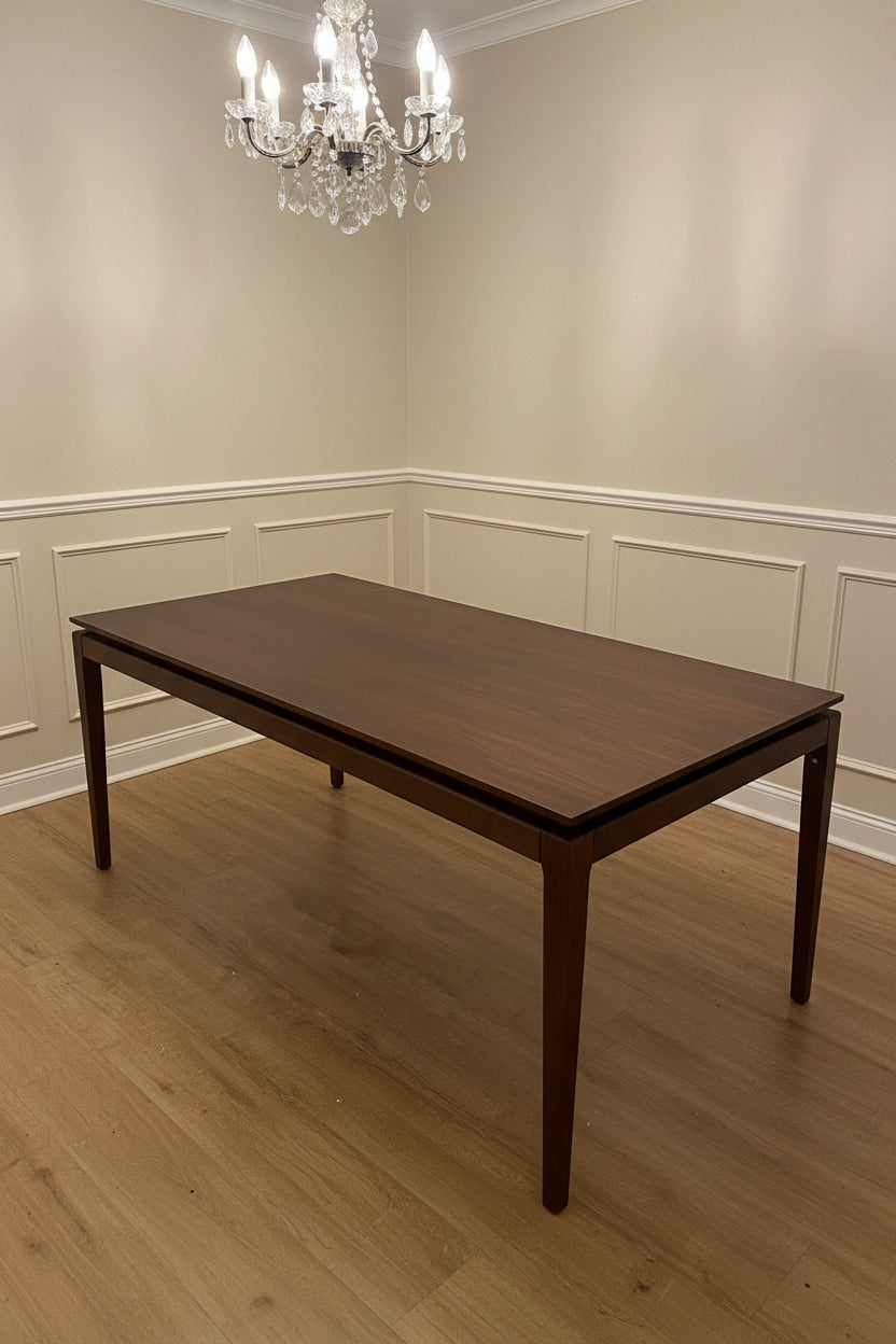 A rectangular walnut wood extending dining table by AM.PM, shown in a contemporary style.