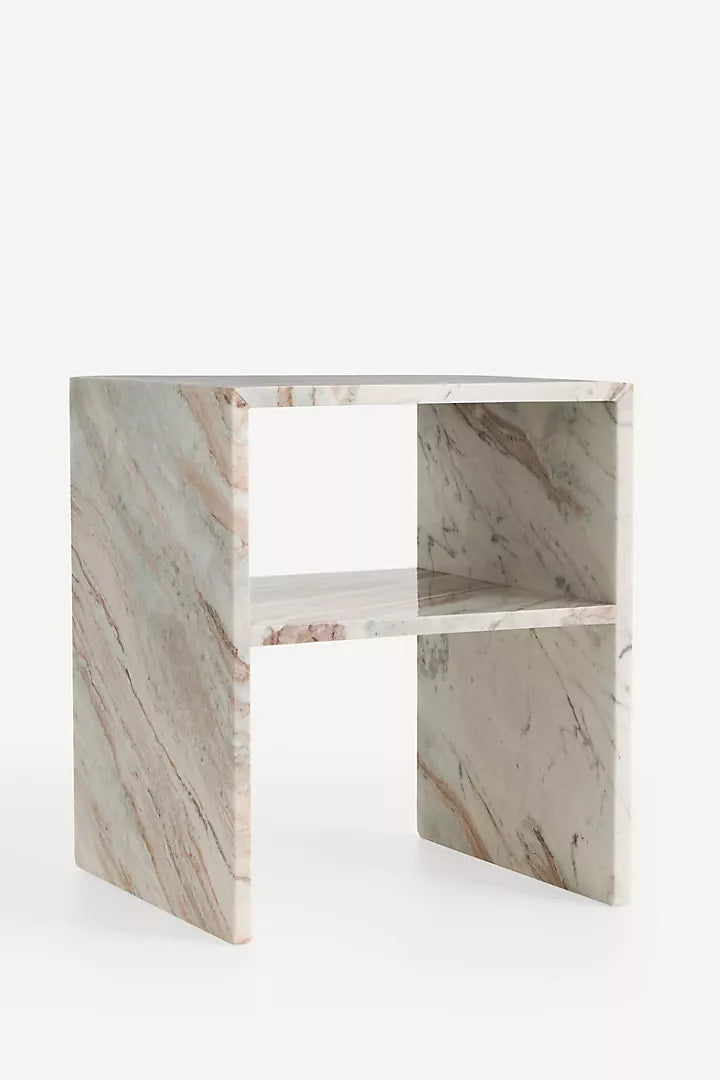 Anthropologie Gia Open Side Table in white veined marble.