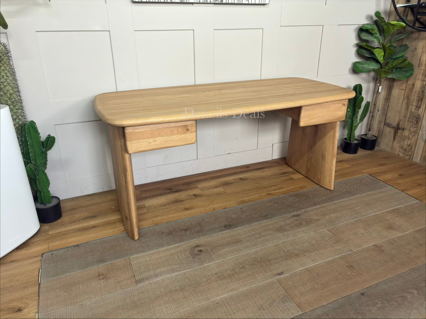 Minimalist oak wood desk featuring an amorphous, curved top and unique sculptural plank legs.