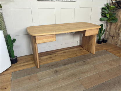 Minimalist oak wood desk featuring an amorphous, curved top and unique sculptural plank legs.