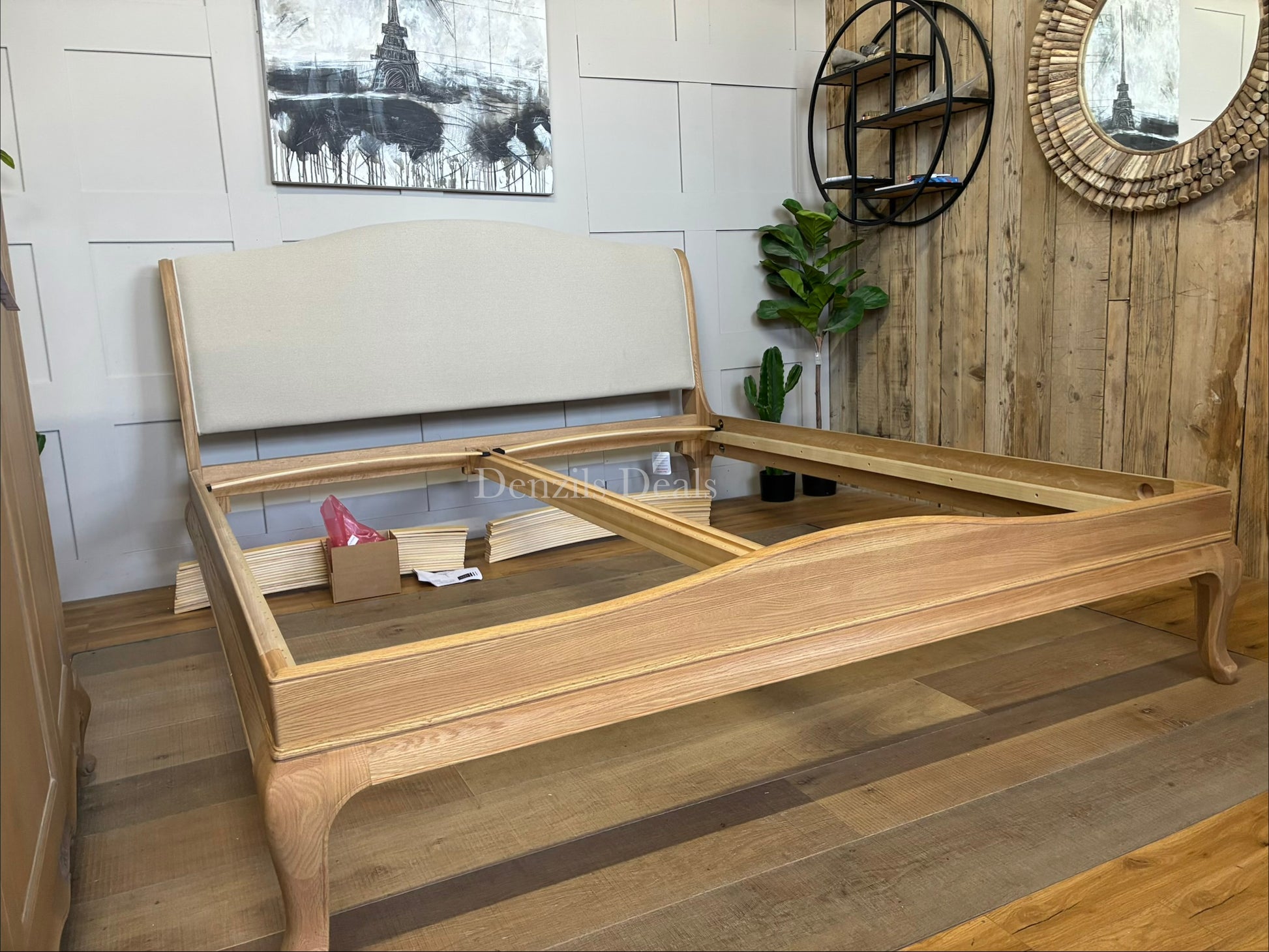 A high-quality John Lewis Louis oak sleigh bed frame in a super king size, featuring a classic curved headboard and footboard with a smooth, natural honey-toned wood grain finish.