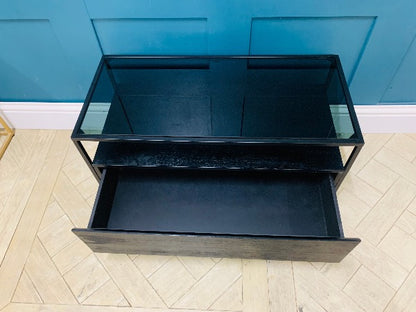 Black stain mango wood TV stand with smoked glass and single drawer.