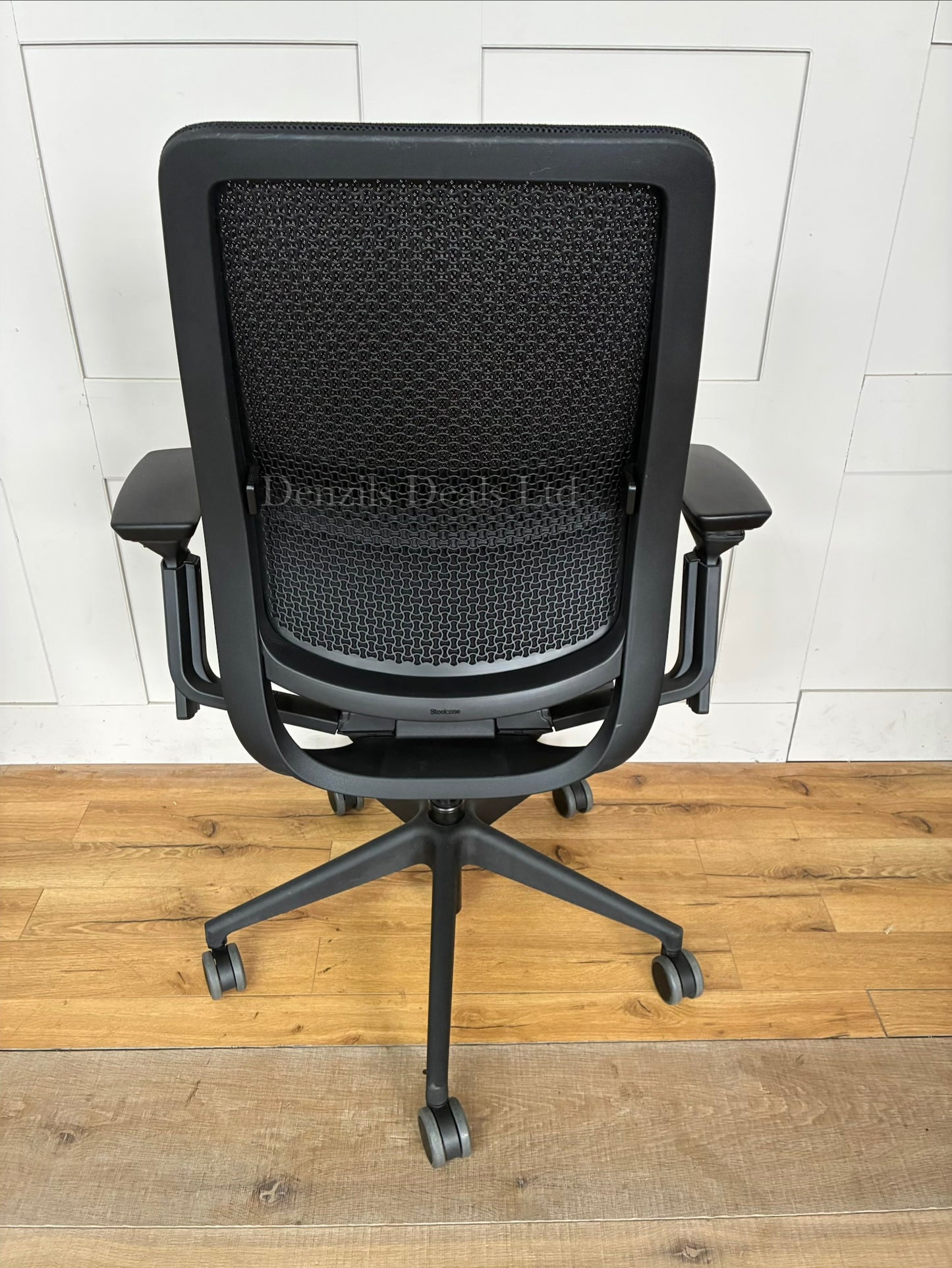 Ergonomic Steelcase Series 2 office chair with a breathable mesh back, visible LiveBack lumbar support, 4D adjustable armrests, and a five-star caster base.