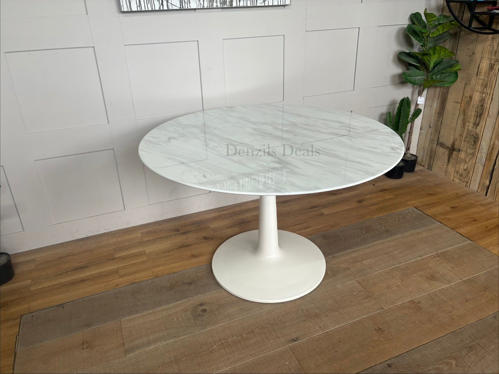 Capello round dining table from Nick Scali showcasing an 18mm high-density natural marble top with a white travertine film, supported by a heavy-duty modern pedestal base