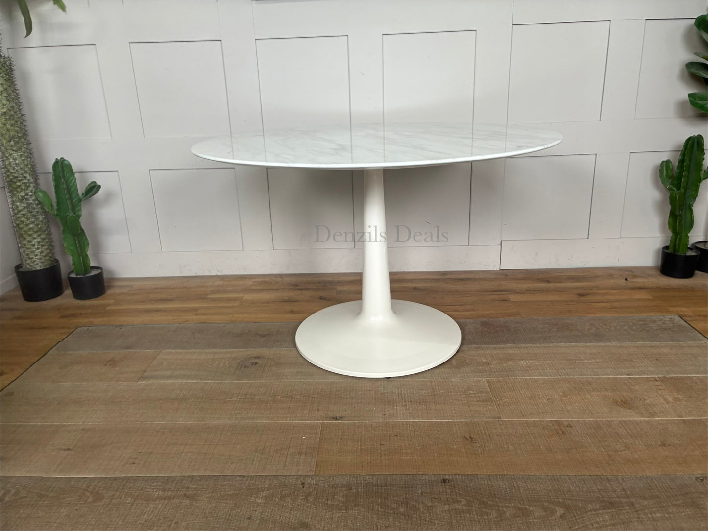 Capello round dining table from Nick Scali showcasing an 18mm high-density natural marble top with a white travertine film, supported by a heavy-duty modern pedestal base