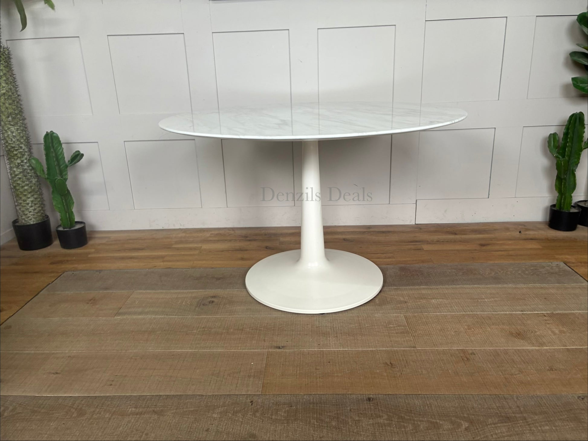 Capello round dining table from Nick Scali showcasing an 18mm high-density natural marble top with a white travertine film, supported by a heavy-duty modern pedestal base