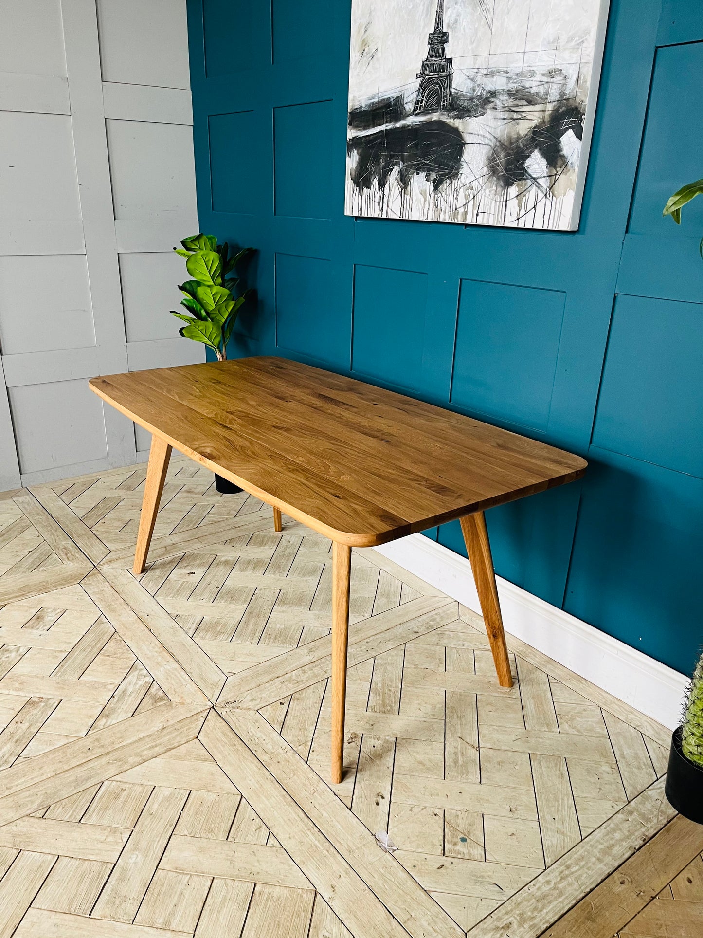John Lewis Cara 4-seater dining table in natural American oak with slender legs and a slim-line top
