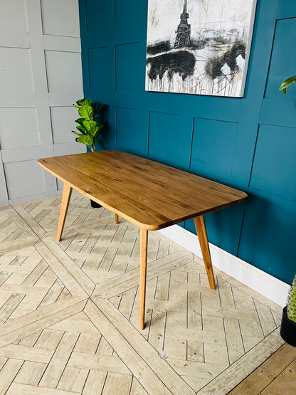 John Lewis Cara 4-seater dining table in natural American oak with slender legs and a slim-line top