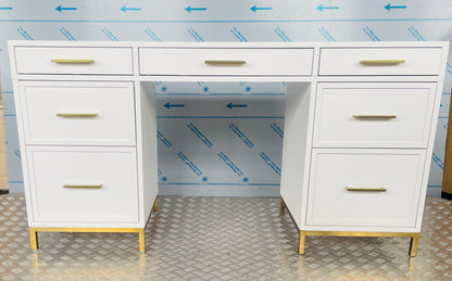 Close-up of the Blaire smart storage desk, highlighting smooth white wood finish and metallic gold hardware.
White Blaire smart storage desk featuring a flat top, symmetrical multi-drawer design, and gold drawer pulls