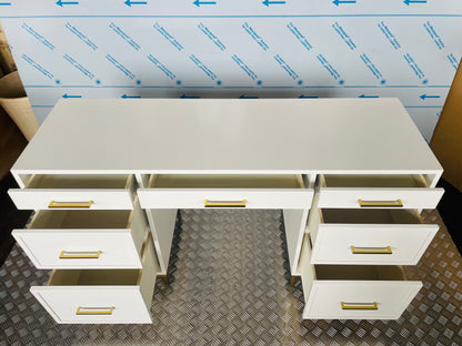 Close-up of the Blaire smart storage desk, highlighting smooth white wood finish and metallic gold hardware. With storage drawers 
