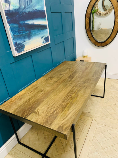 Close-up of the rich dark mango wood grain and smooth finish of the MADE Morland dining table.