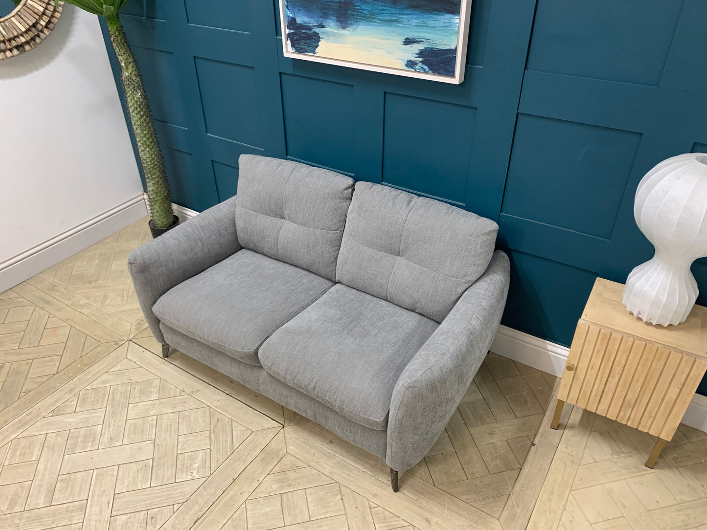 Compact Sofology Mimi grey fabric 2 seater sofa in a modern, space-saving living room setting.