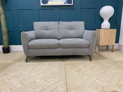 Compact Sofology Mimi grey fabric 2 seater sofa in a modern, space-saving living room setting.
