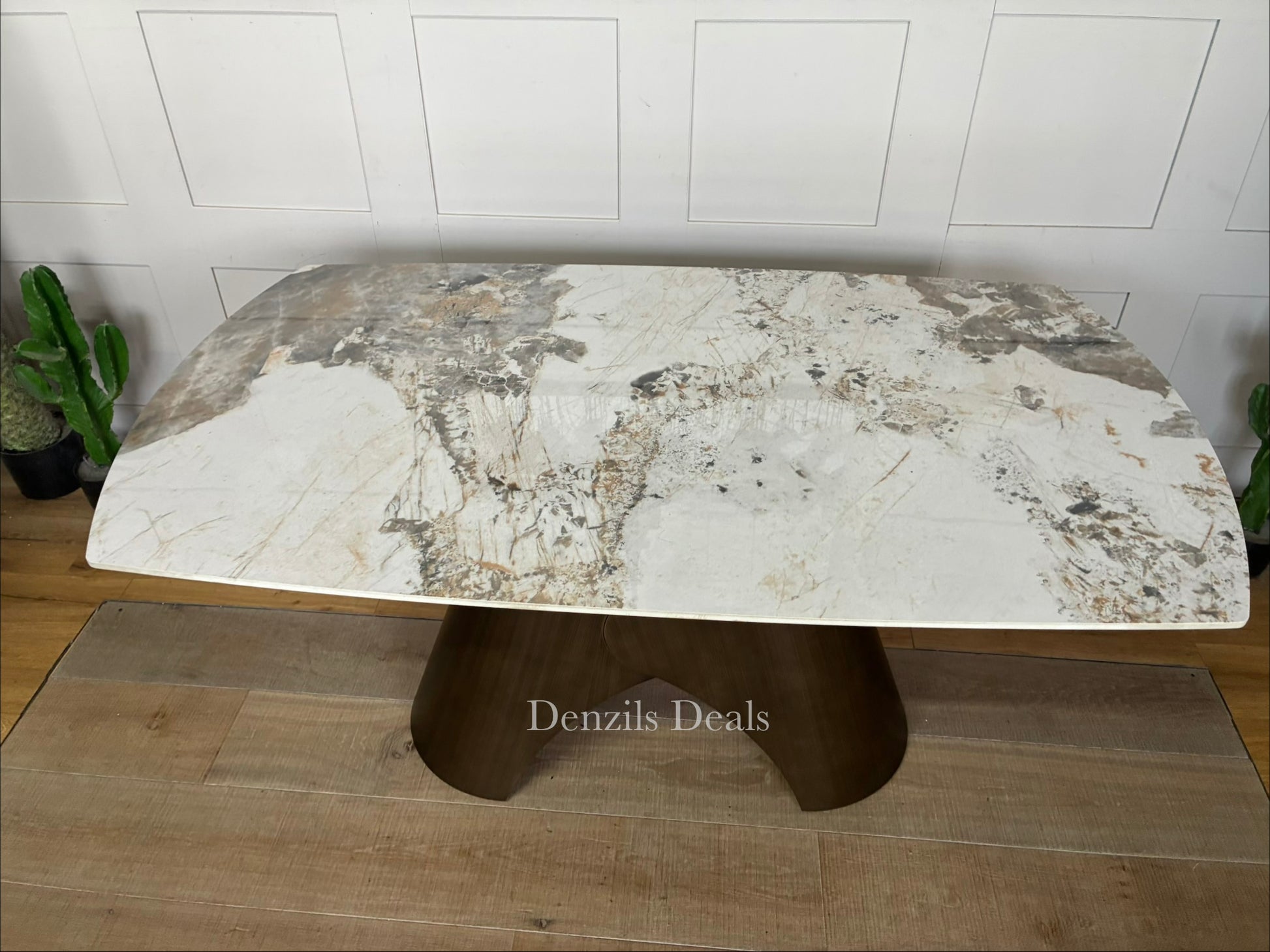 Contemporary oval extending dining table featuring a Pandora marble-style ceramic top and a sculptural matte bronze metal pedestal base